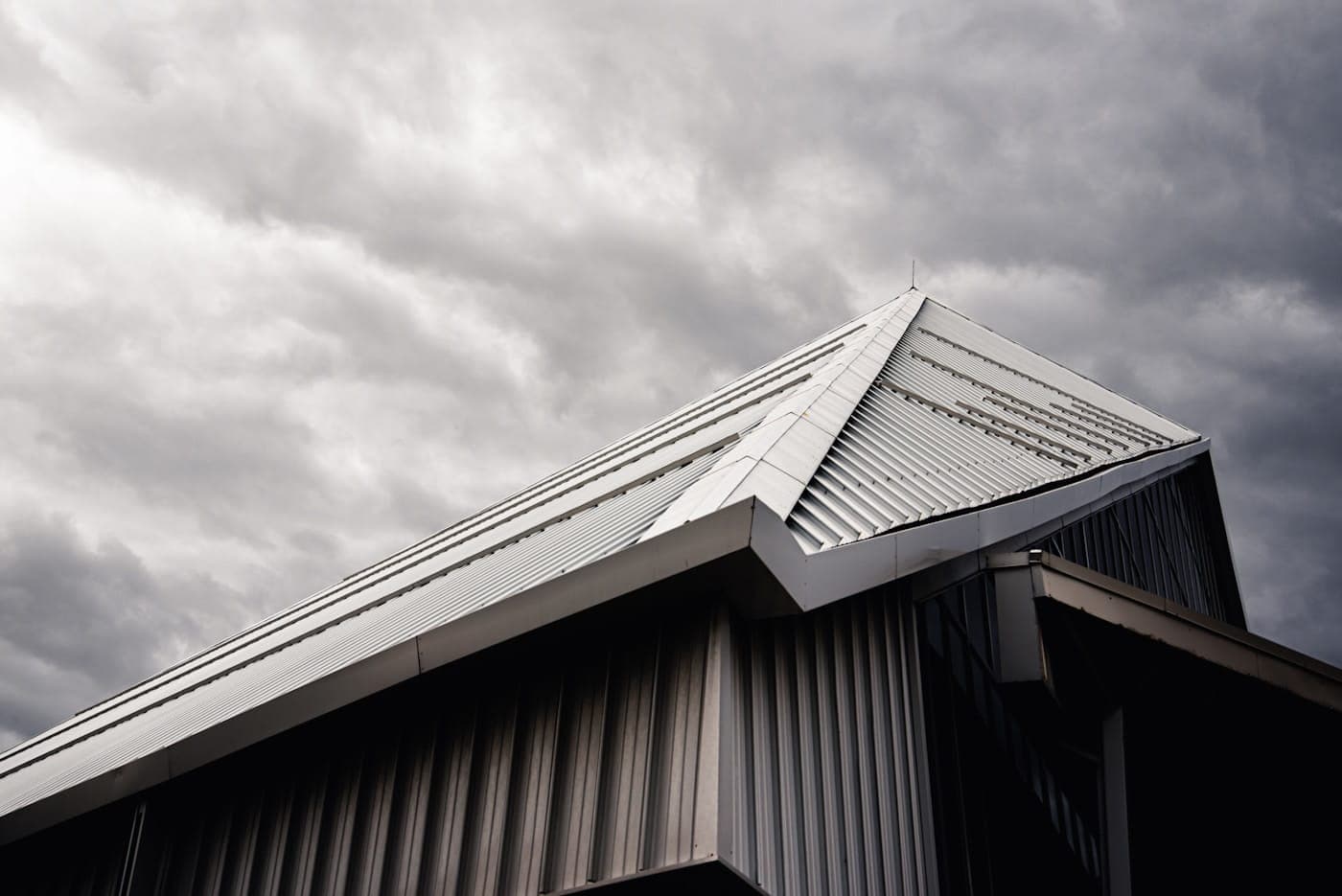 Home with new grey ribbed metal roofing