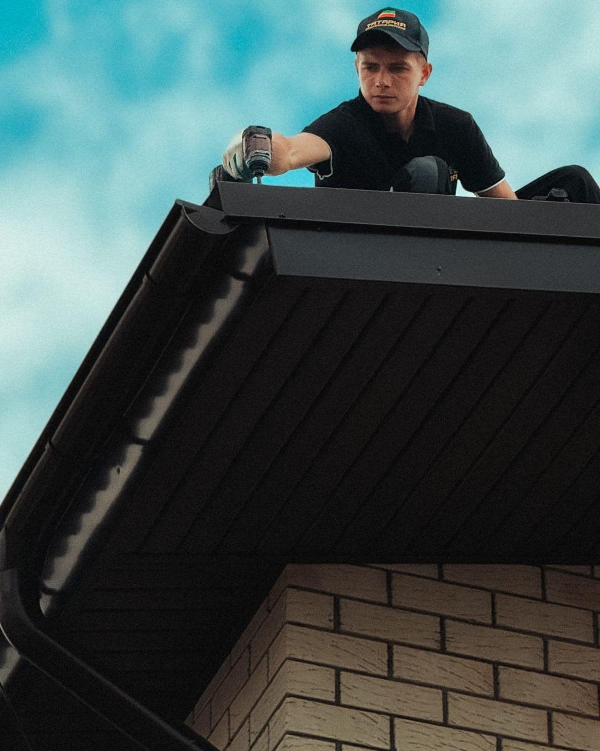 Roofer installing a Colorbond metal roof